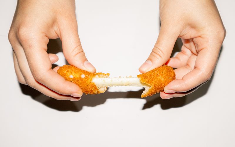 Cheesy mozzarella sticks with dipping sauce
